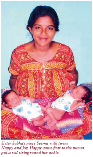 Sister Sobha's niece Seema with twins Happy and Joy.  Happy came first so the nurses put a red string around her ankle