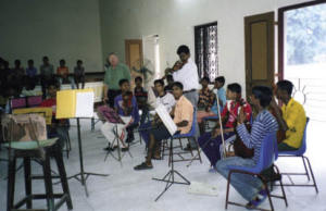 Bishop Bill Down with Sanjib and the boys practicing in the MMMC