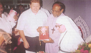 With Bishop Raju, who holds a birthday card from the Queen brought by the Acting British Deputy High Commissioner (left)