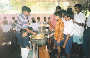 Boys queueing up for their meal -