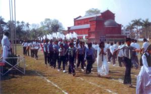 OM High School Sports Day: march past (Father Francis on left)